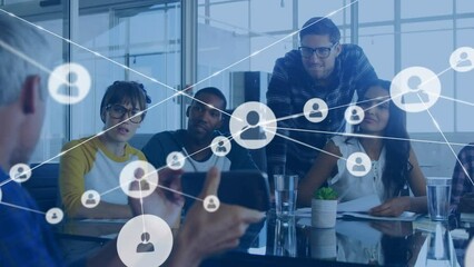 Poster - Animation of connected profile icons over diverse man showing cellphone and explaining to coworkers