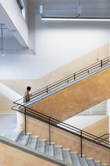 Poster - Interior view of a unrecognized people walking upstairs