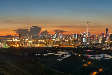 Wall Mural - Panorama of skyline of Shenzhen city, China at sunset. Viewed from Hong Kong border