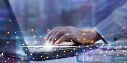 man using laptop with internet network digital data and city, connection and communication technology, big data and online marketing concept