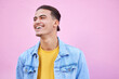 © Lumeez/peopleimages.com - Student man, happy and fashion by background with smile, motivation or lifestyle with vision. Young gen z guy, excited and dream for future with goals, happiness and edgy clothes by pink wall in city