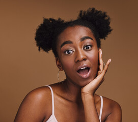 Poster - Beauty, skincare and portrait of shocked black woman with hand in face isolated on brown background. Surprise, wow and facial cosmetics or natural makeup for healthy, glowing skin on model in studio.