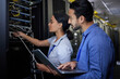 © Nina L/peopleimages.com - Man, woman or server room maintenance on laptop IT, software programming ideas or cybersecurity engineering. People, repair or data center technology in teamwork collaboration of safety analytics fix