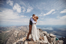 Newlywed Couple Has First Kiss During Wedding On Mountaintop, Wyoming.