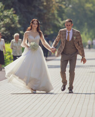 Wall Mural - The bride and groom in a wedding dress.