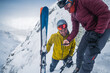 © Cavan Images - Two skiers looking at footage on a phone