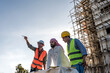 © Jack Tamrong - Engineer Construction men showing building project to arab businessman in construction site