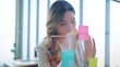 © M Stocker - Asian businesswoman standing and writing project tasks on post it sticky notes on glass wall in office