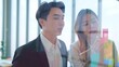 © M Stocker - Two professional asian businesspeople share ideas and discuss project vision analyze using post it sticky notes on glass wall in office