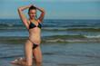 © zhagunov_a - beauty athletic woman in a swimsuit on the beach