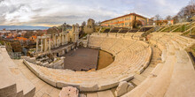 Plovdiv Roman Amphitheatre In Cloudy Day. Ancient Roman Theatre Ruins In Bulgaria.