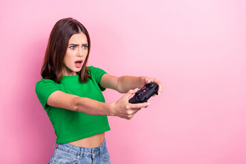 Canvas Print - Photo of pretty impressed girl open mouth hold controller look empty space isolated on pink color background