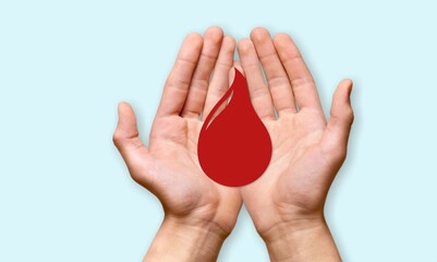 Poster - Blood donation concept, Hands holding a red drop of blood