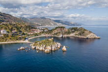 Aerial View Of Isola Bella, A Small Island And Touristic Spot Along The Coastline In Taormina, Messina, Sicily, Italy.