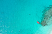 Aerial View Of A Small Fishing Boat Along The Reef In Guraidhoo, Maldives Archipelagos.