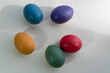 painted easter eggs laying on white table