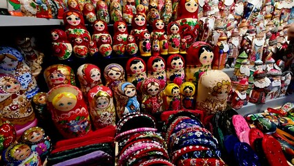 Wall Mural - Budapest, Hungary, August 2022. At the central market pan footage on the counter of wooden dolls typical of the place. Pan movement