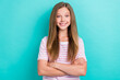 © deagreez - Portrait of satisfied glad young girl beaming smile crossed arms isolated on turquoise color background