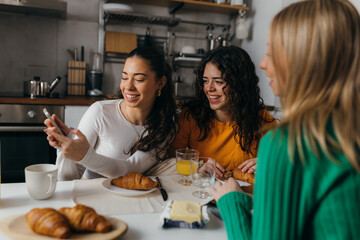 Wall Mural - Three women are having brunch together