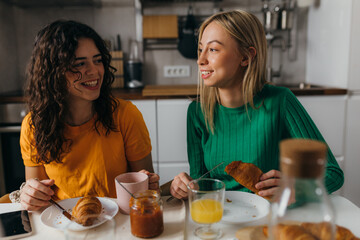 Wall Mural - Two women are having breakfast together