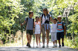 © BalanceFormCreative - School kids hiking at the park with they teacher.They're learning about nature and wildlife.