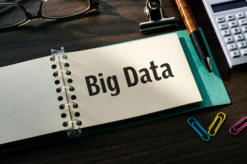 Poster - There is a notebook with the word Big Data. It is an eye-catching image.