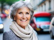 © Dawid - Smiled senior woman with scarf standing on city street. Portrait. Blurry background. Generative AI
