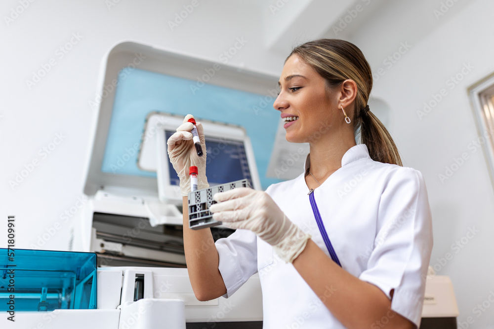Lab Tech Pic Lab tech loading samples into a chemistry analyzer. female lab tech ...