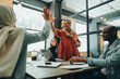 © Jacob Lund - Two cheerful businesswomen celebrating their success