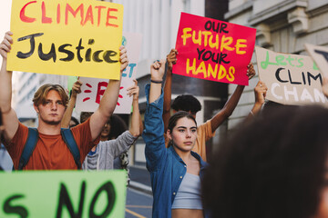 Wall Mural - Young people marching against global warming in the city