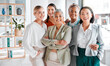 © Lumeez/peopleimages.com - Diversity, portrait and business women with support, teamwork and group empowerment in office leadership. Career love and hug of asian, black woman and senior people or employees smile for solidarity