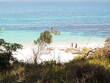 © Austockphoto - Distant family on beach in Jervis Bay