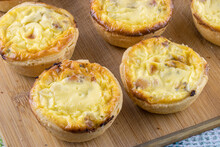 Appetizer Quiches Homemade On Wooden Kitchen Board Close Up