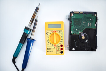 Aufkleber - Tools to fix computer parts, hard drive and isolated on white background, technology and engineering in repair workshop. Hardware maintenance, problem diagnosis and machine assembly in empty studio.