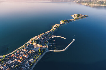 Wall Mural - Aerial sunset view of Egirdir lake peninsula and town in Isparta region. Calm turquoise and scenic coast of national park in Turkey