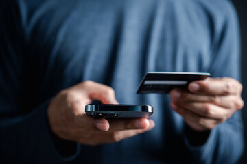 Shopping online payment E-commerce concept. Man hand using smart phone, banking and online shopping via mobile banking app, E-transaction and financial technology