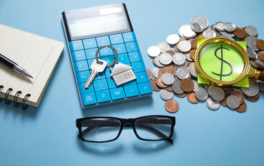 Wall Mural - House keys, calculator and stack of coins.