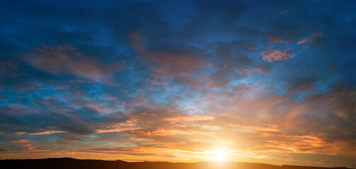 Wall Mural - cloudy sky panorama during summer sunset