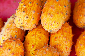 Wall Mural - Stack of horned melons on a market stall