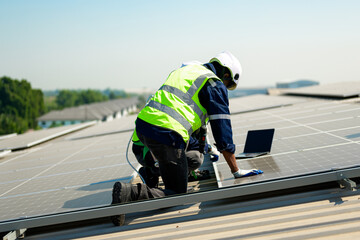 Wall Mural - Professional technicians installing solar panels on rooftop of plant, Workers checking and operating system at solar cell farm power plant, Renewable energy source for electricity and power