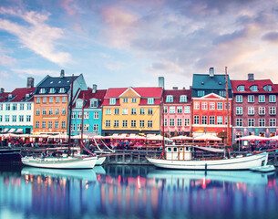 Wall Mural - magical fascinating landscape with boats in a famous nyhavn in the capital of denmark copenhagen. ex