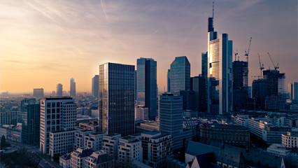 Wall Mural - aerial view of the skyscrapers in the city against the sky at sunset