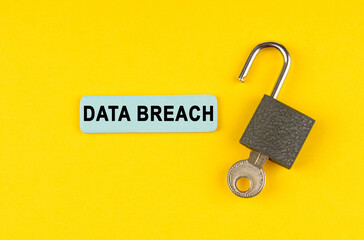 Poster - On the yellow surface lies an open lock with a key, next to it is a sticker with the inscription - Data breach