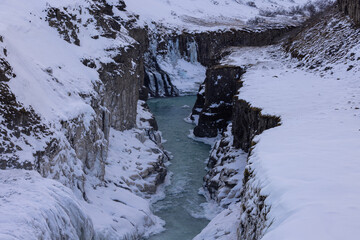 Wall Mural - A small valley of rock and ice covered by snow just after Gulfoss in Iceland.