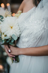 Wall Mural - Beautiful wedding bouquet in hands of the bride.