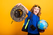 Child with backpack, explorer. Concept of exploration and discovery. Kid hold world globe, adventure and tourism, leisure trips. Travel and adventure vacation. Kid exploring world.