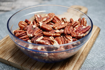 Sticker - Tasty pecan-nut in a bowl on table 