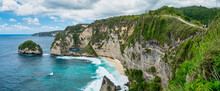 Atuh Beach Is A Rustic, Isolated Cove Beneath A Sheer Cliff Face, With A Sandy Beach Offshore Rock Formations.