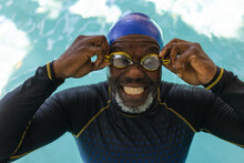 African American Senior Man Wearing Swimming Glasses In The Swimming Pool