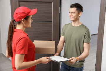 Poster - Man receiving parcel from courier at house entrance